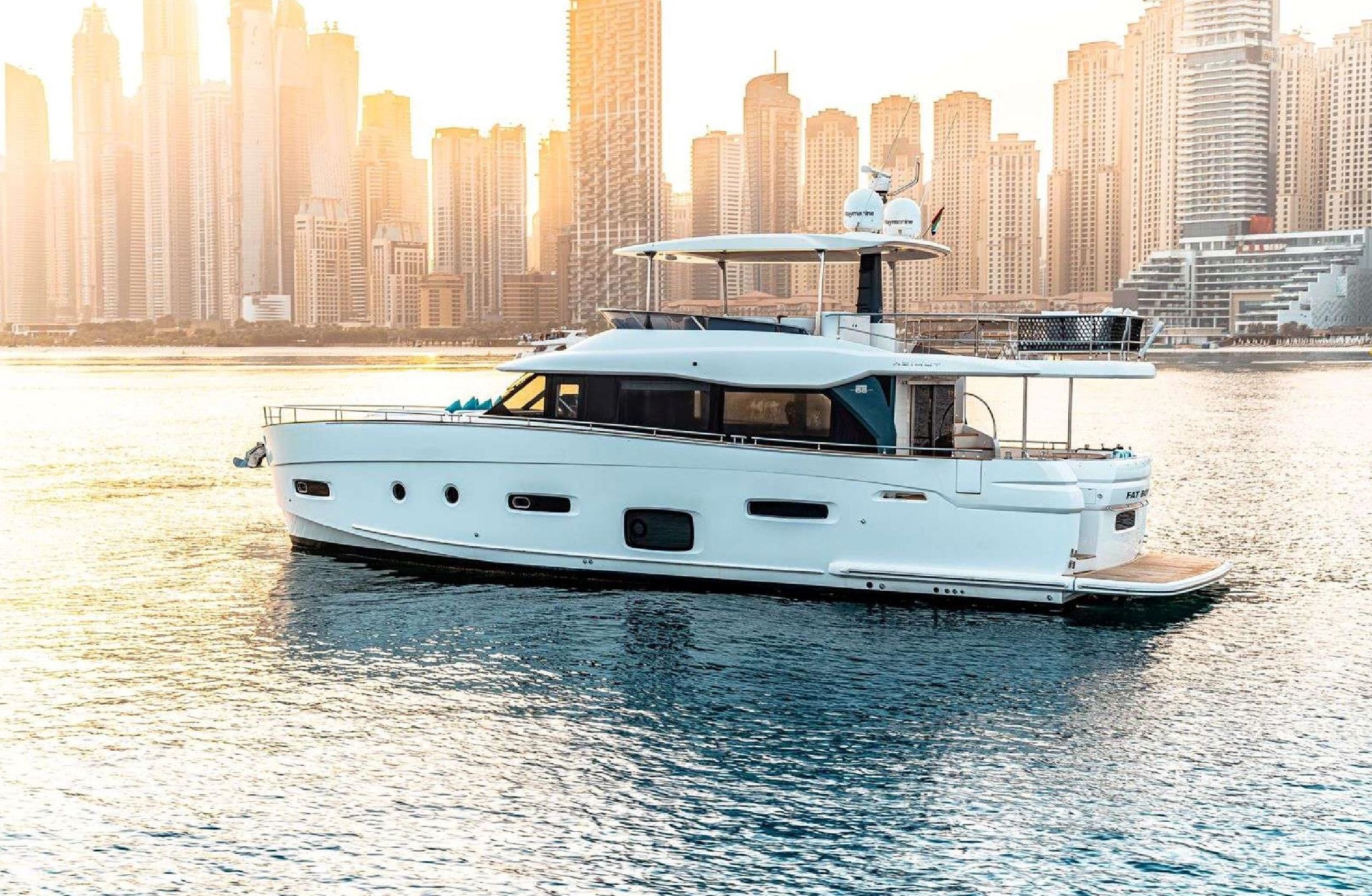 2022 Azimut Magellano 66 at golden hour off Dubai Marina